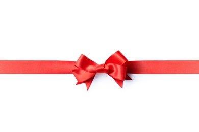 Red ribbon with bow on white background. Festive decoration