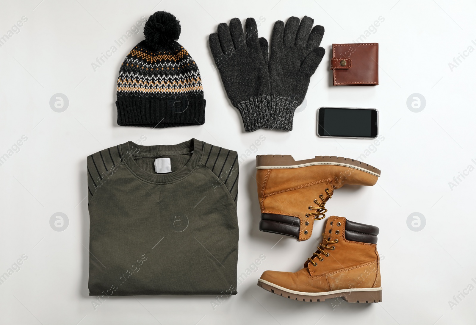 Photo of Flat lay composition with male winter clothes on white background