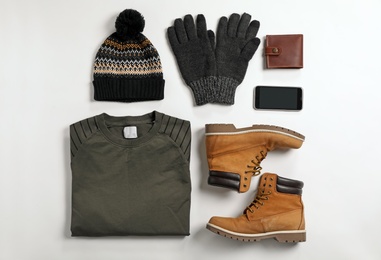 Photo of Flat lay composition with male winter clothes on white background