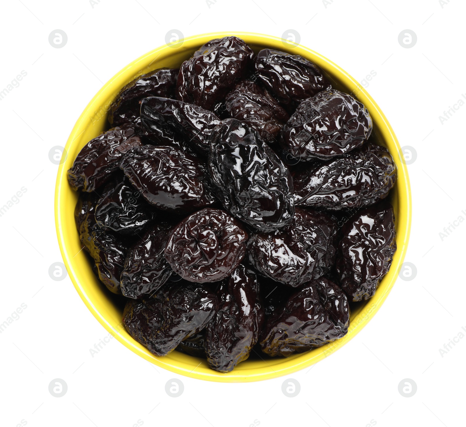 Photo of Bowl with sweet dried prunes isolated on white, top view