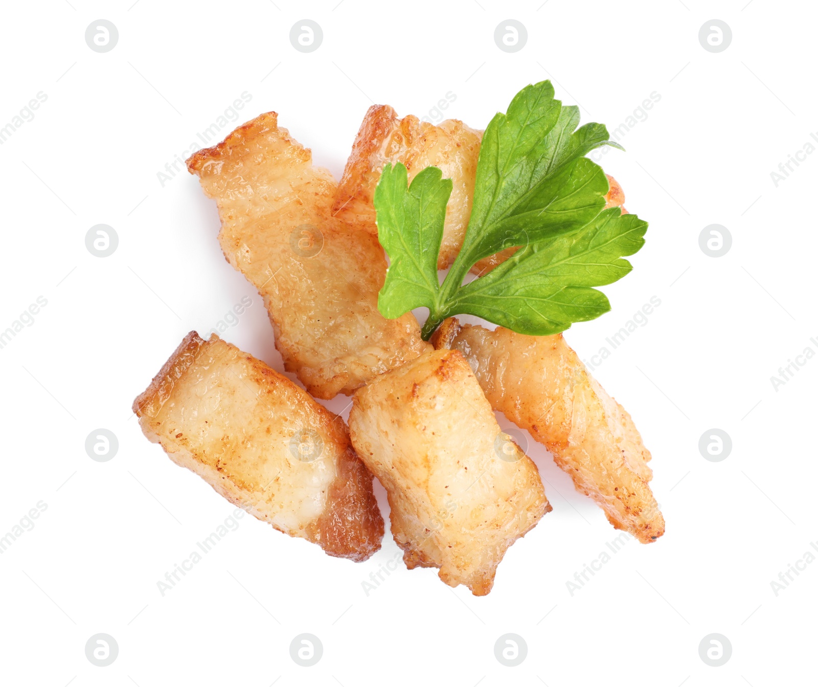 Photo of Tasty fried cracklings with parsley on white background, top view. Cooked pork lard