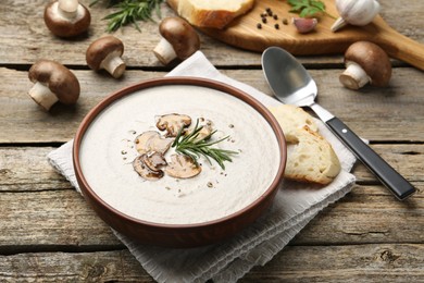 Fresh homemade mushroom soup served on wooden table