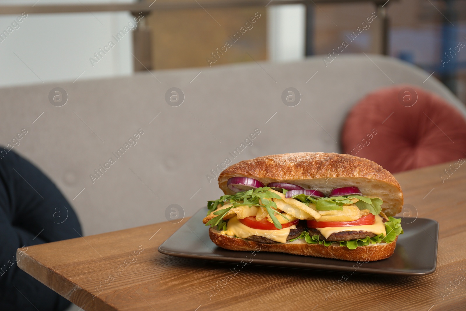 Photo of Plate with yummy sandwich on table in cafe. Space for text