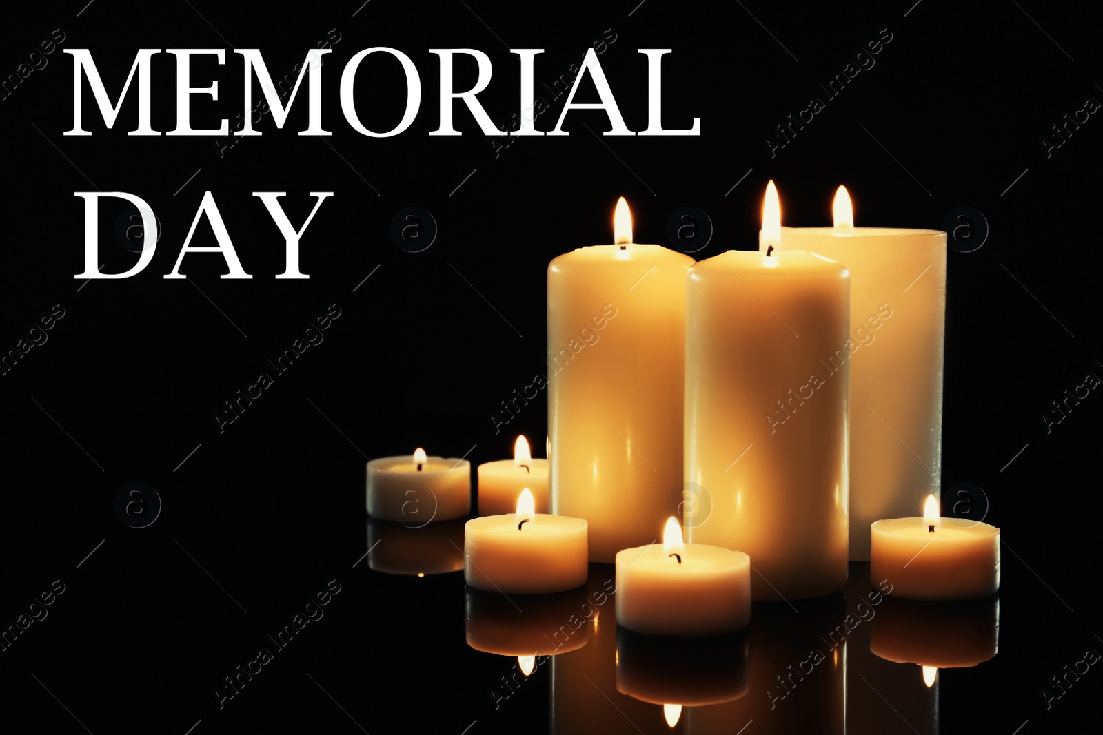 Image of Memorial day. Wax candles burning on black background