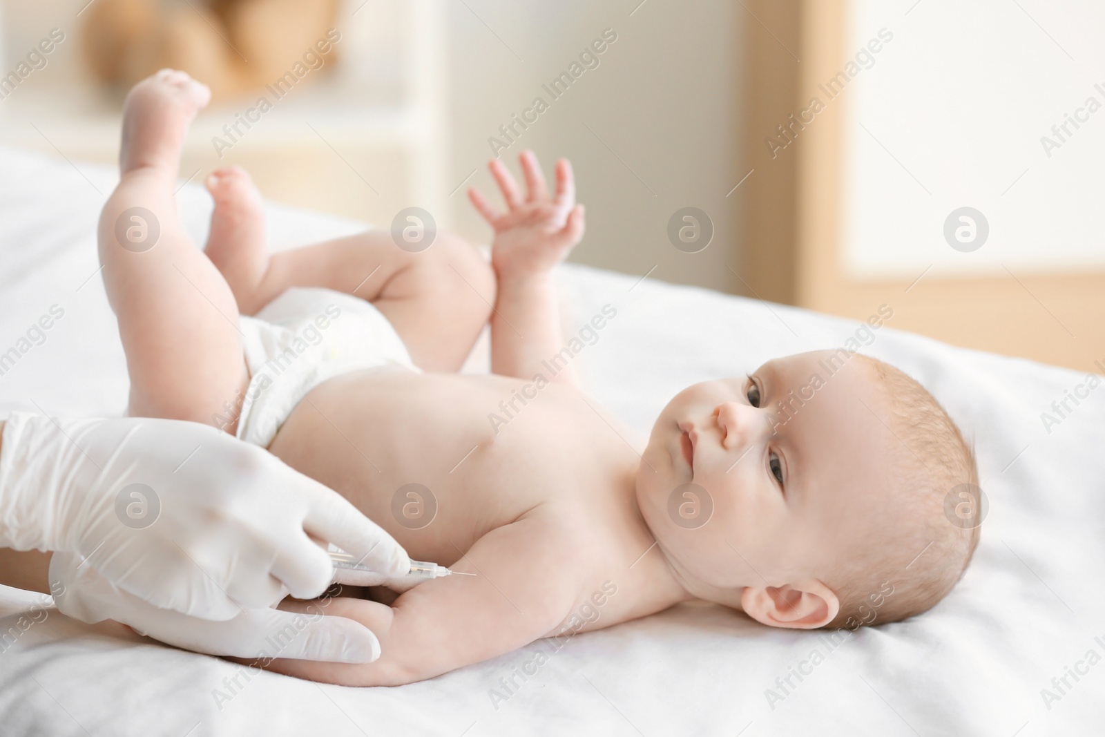 Photo of Doctor vaccinating baby in clinic