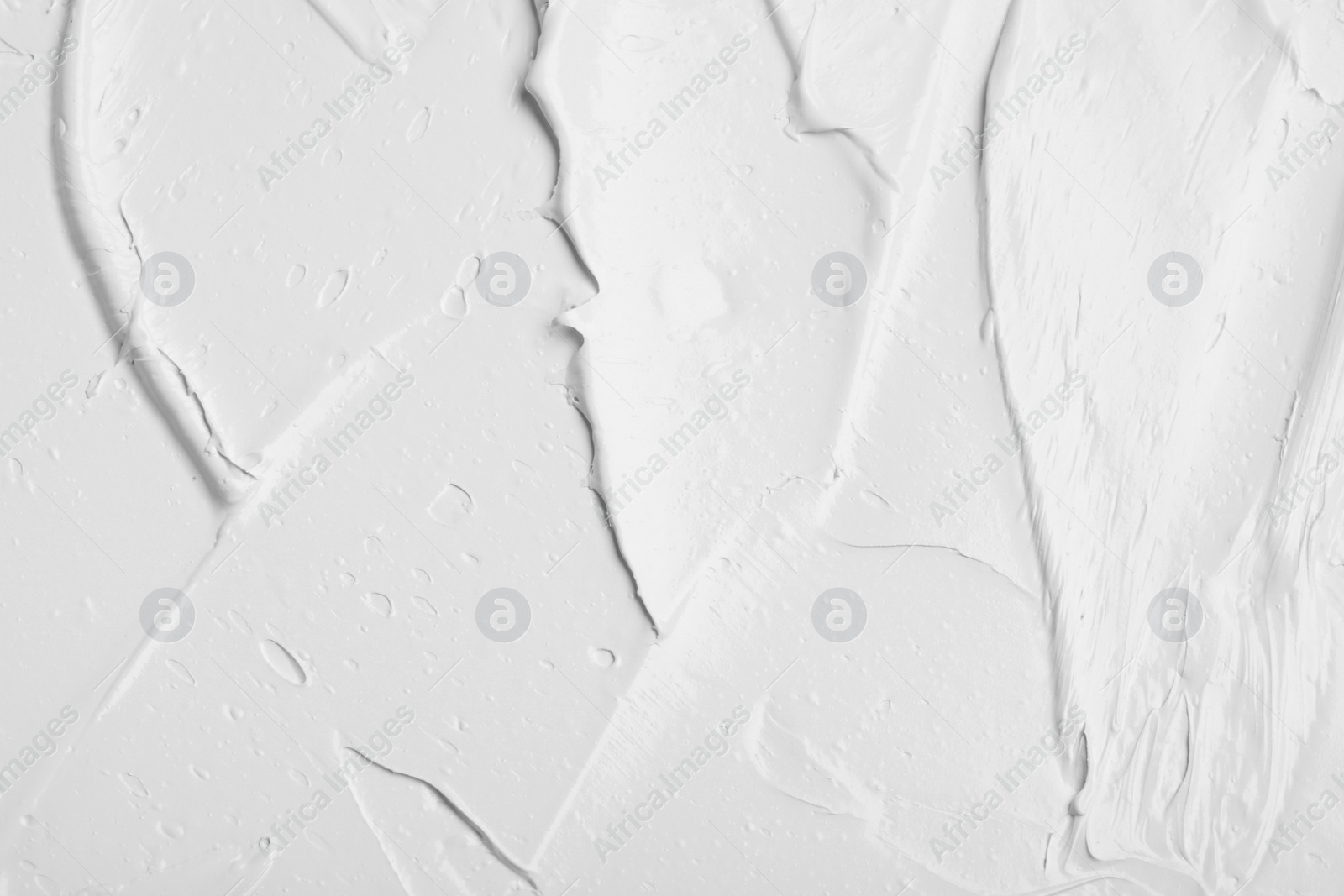 Photo of Texture of white oil paint as background, closeup