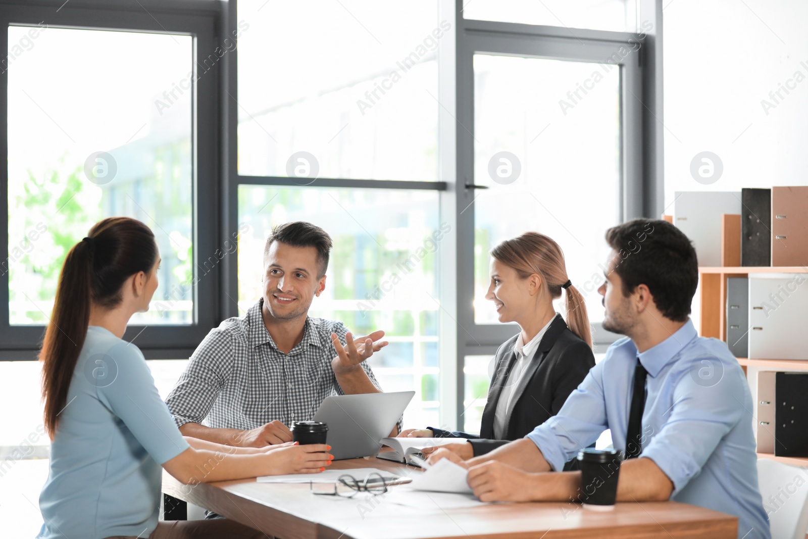 Photo of Office employees having business training at workplace