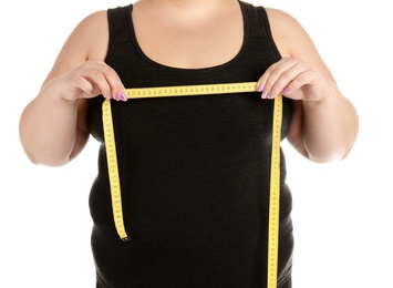 Overweight woman with measuring tape on white background, closeup