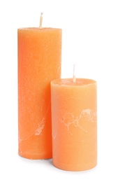 Two decorative wax candles on white background