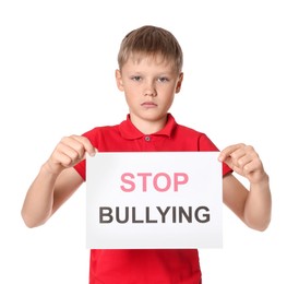 Boy holding sign with phrase Stop Bullying on white background
