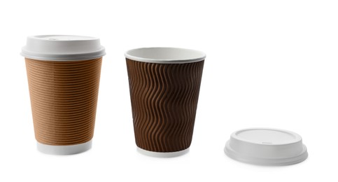 Photo of Takeaway paper coffee cups with lids on white background