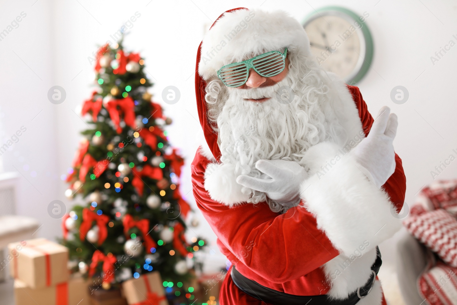 Photo of Authentic Santa Claus with funny glasses indoors