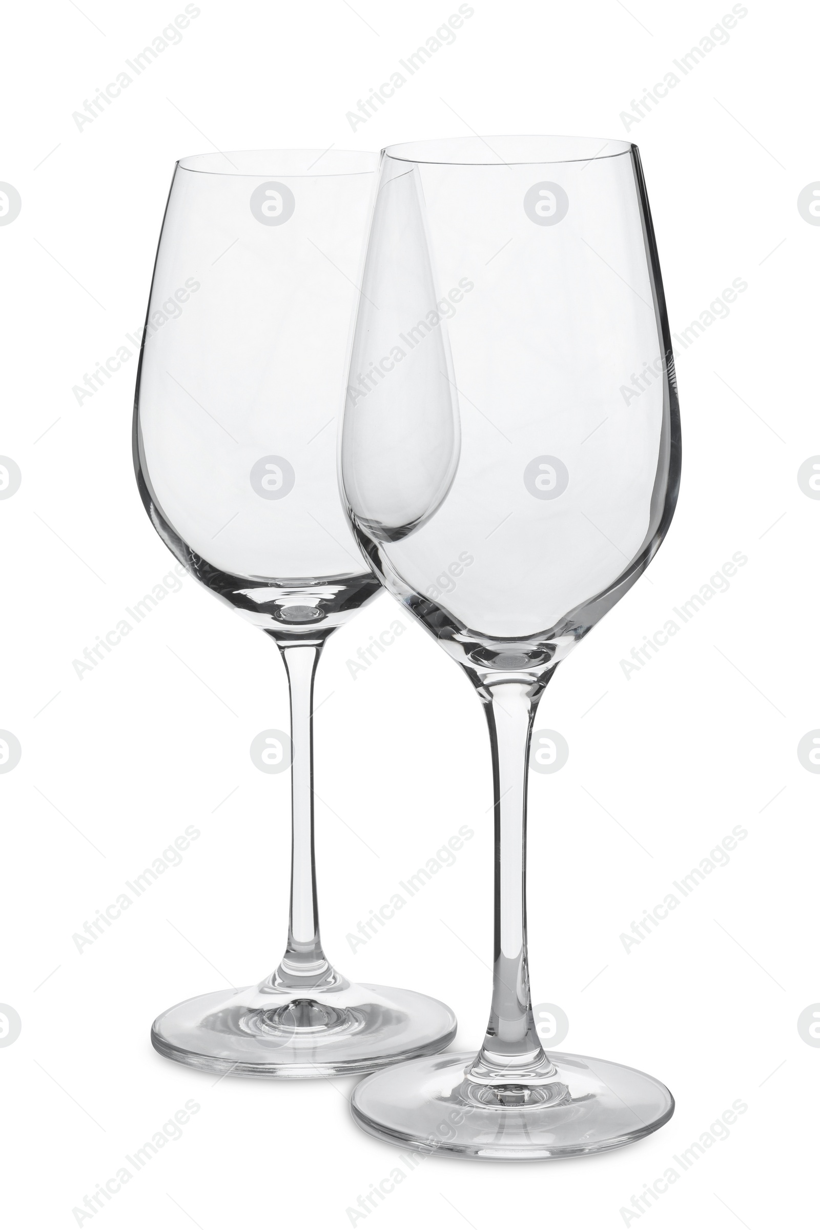 Photo of Elegant clean empty wineglasses on white background