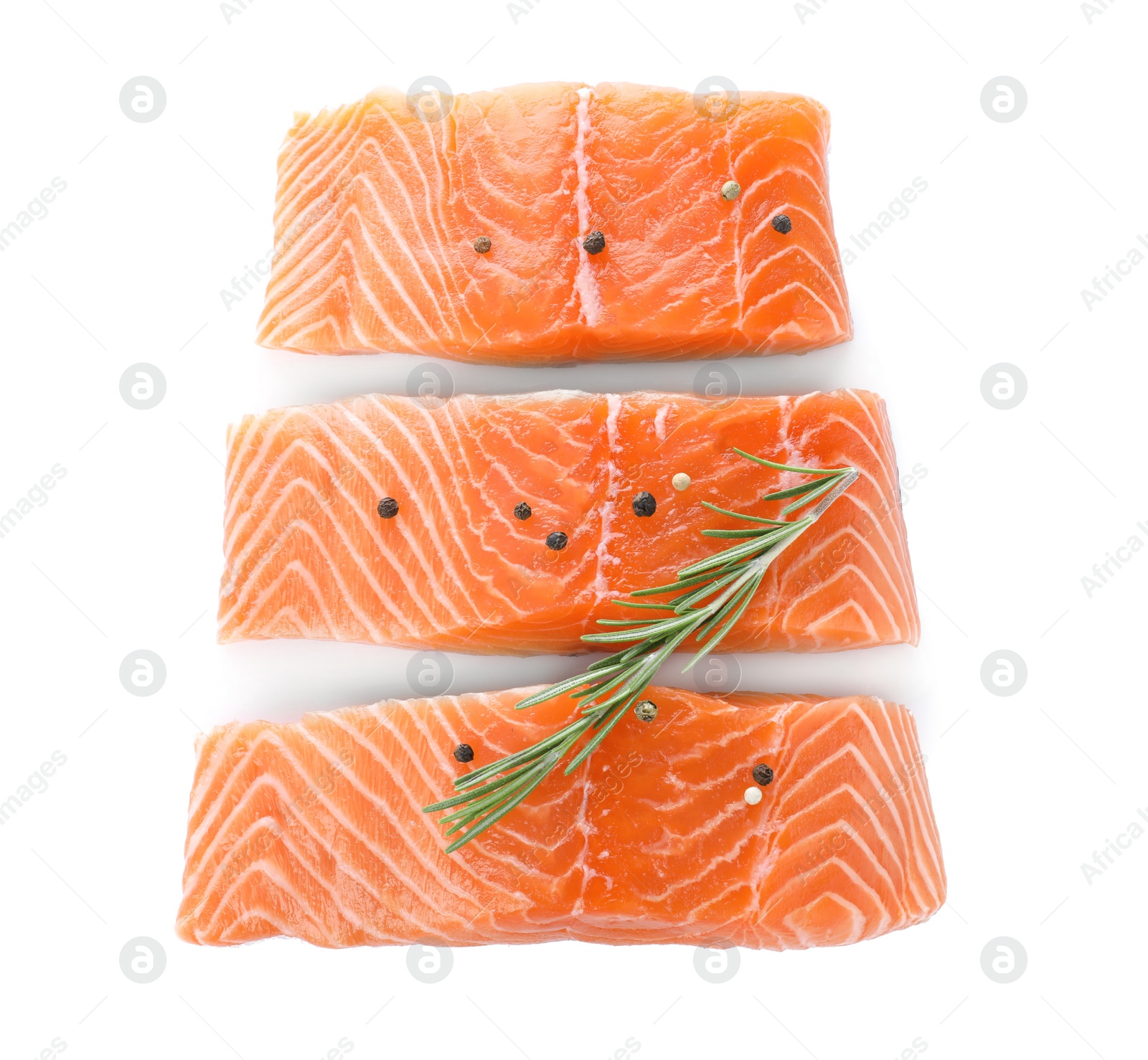 Photo of Fresh raw salmon with pepper and rosemary on white background, top view. Fish delicacy