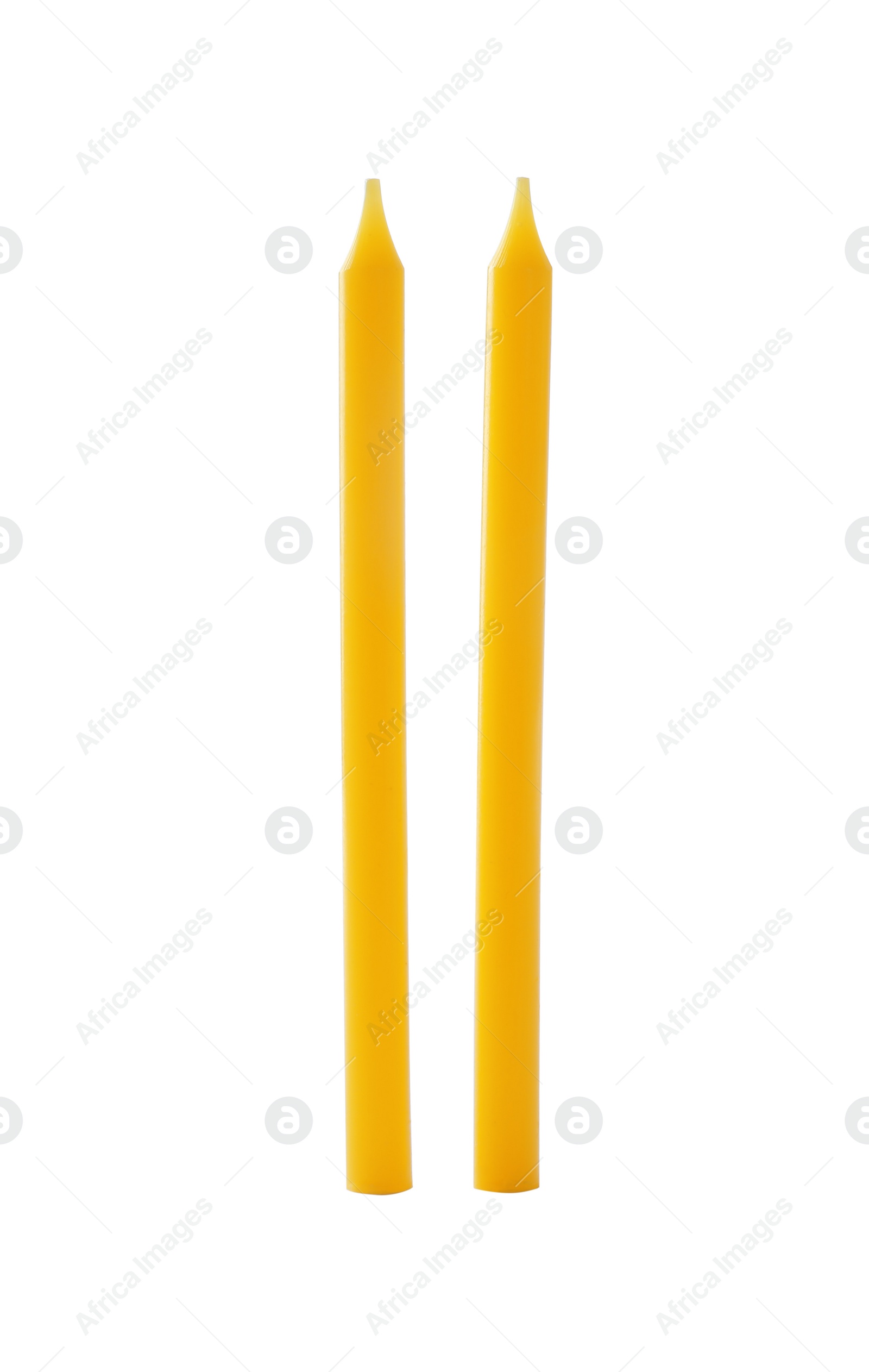 Photo of Thin yellow birthday candles isolated on white