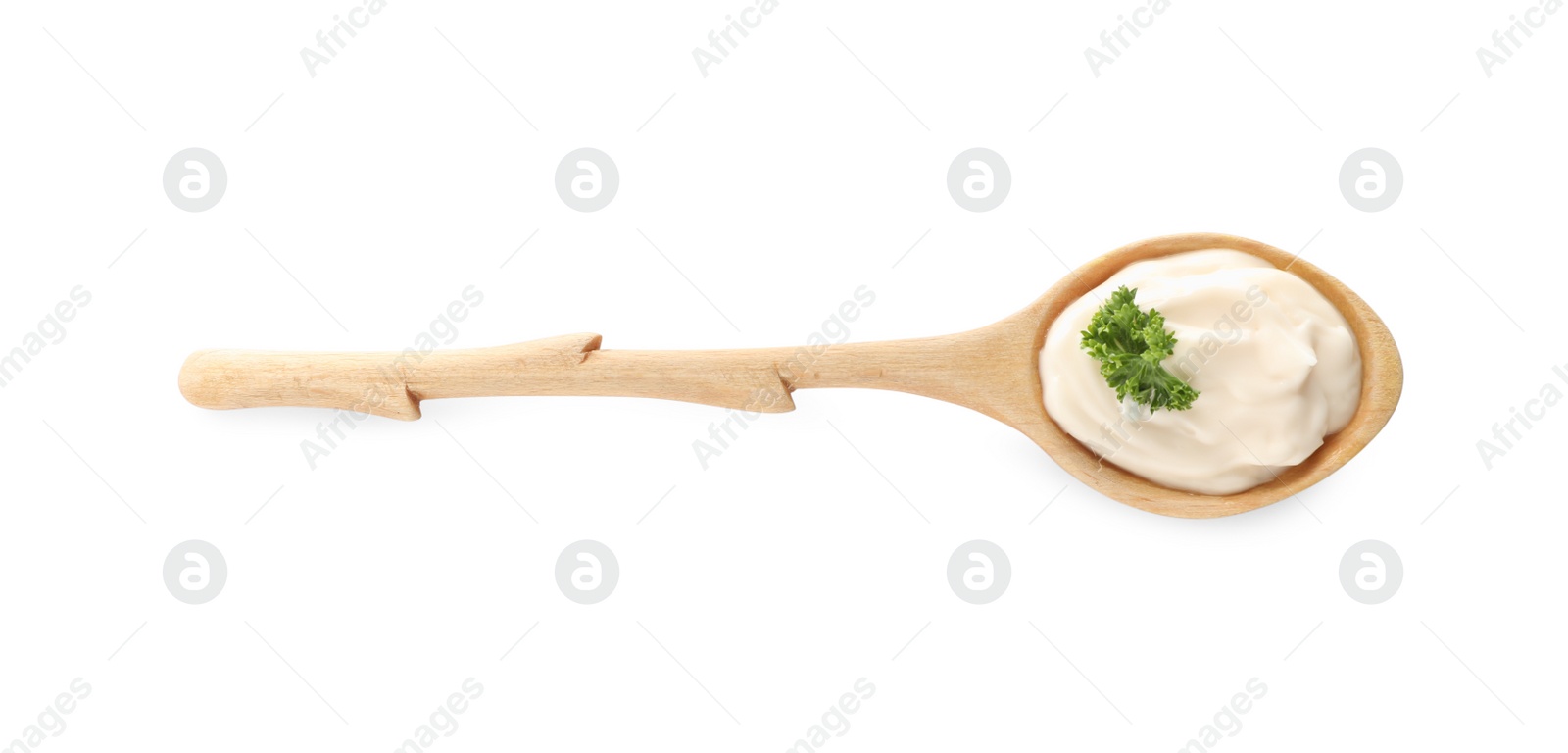 Photo of Wooden spoon with tasty mayonnaise and parsley isolated on white, top view