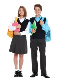 Happy pupils in school uniform on white background