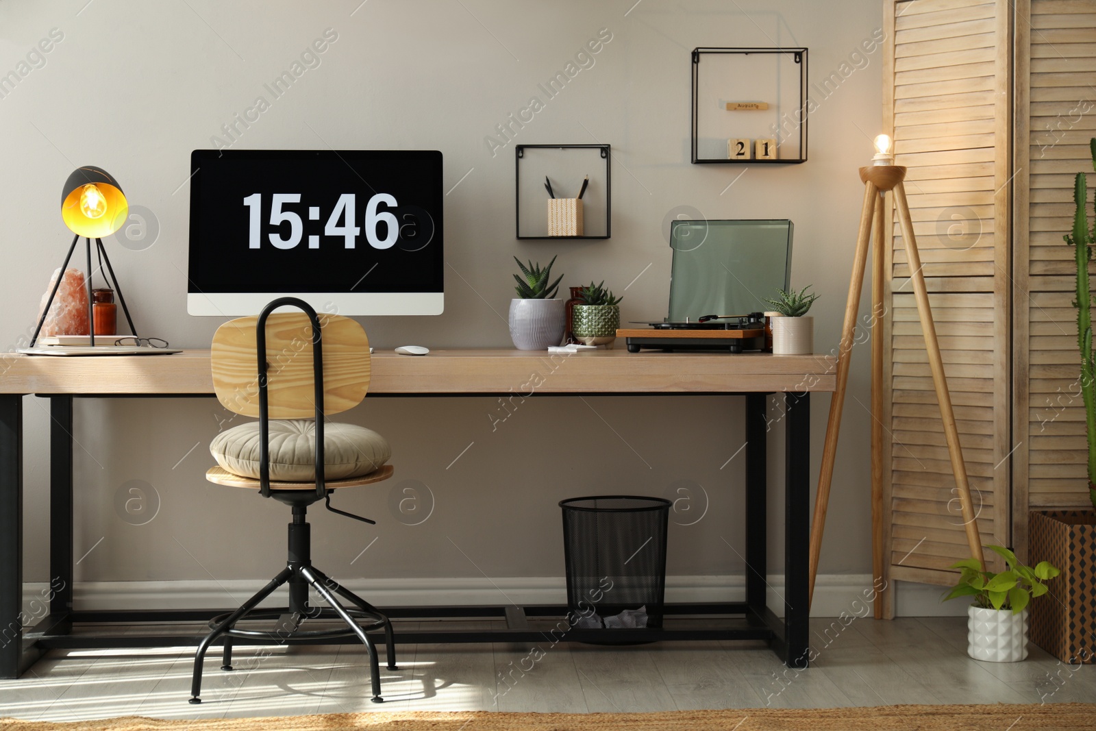 Photo of Room interior with comfortable workplace. Modern computer on wooden desk