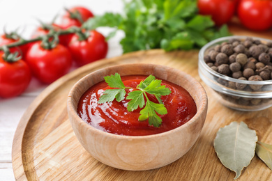 Photo of Delicious fresh tomato sauce on table, closeup
