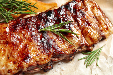 Delicious grilled ribs with rosemary, closeup view
