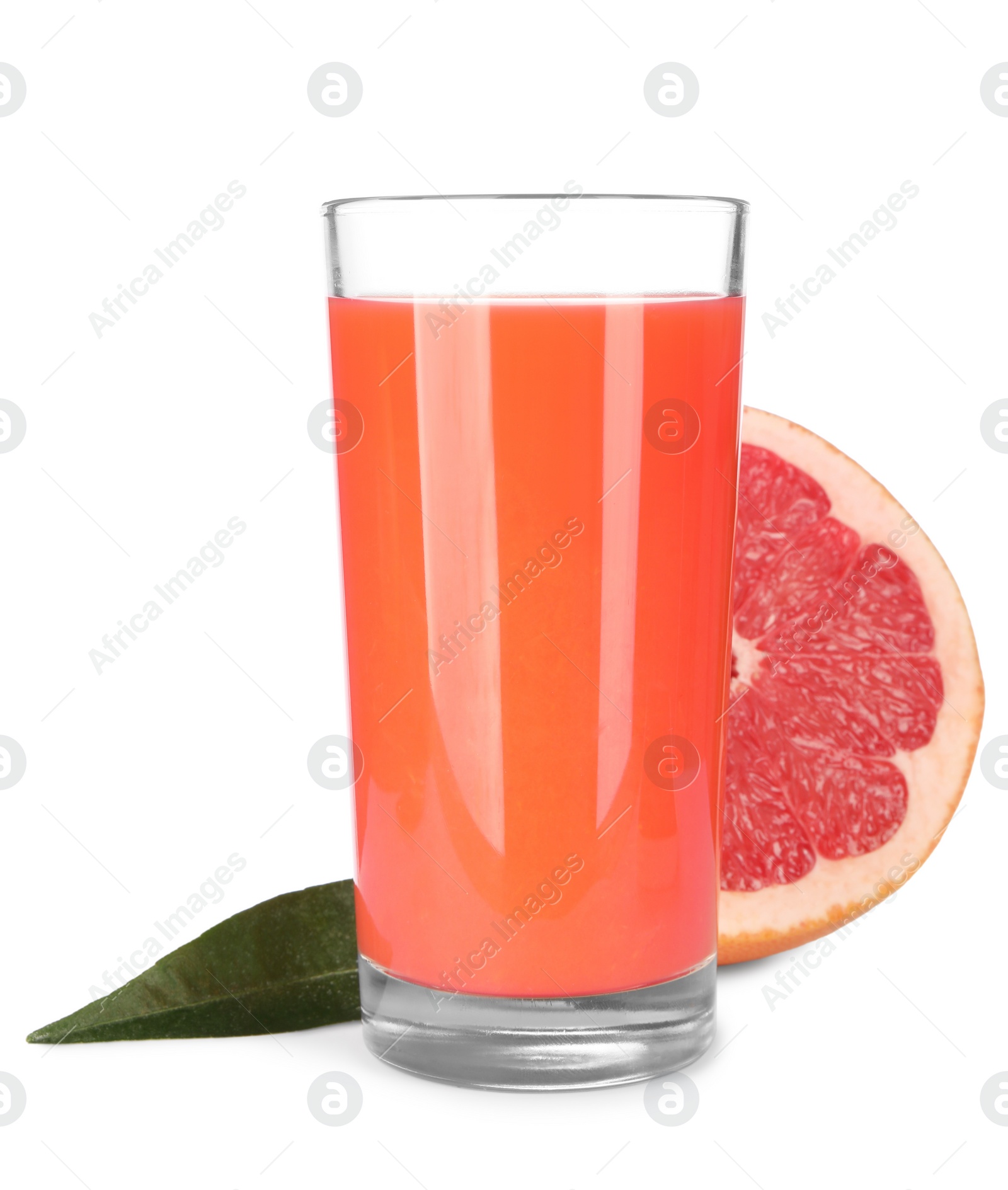 Photo of Tasty grapefruit juice in glass, fresh fruit and green leaf isolated on white