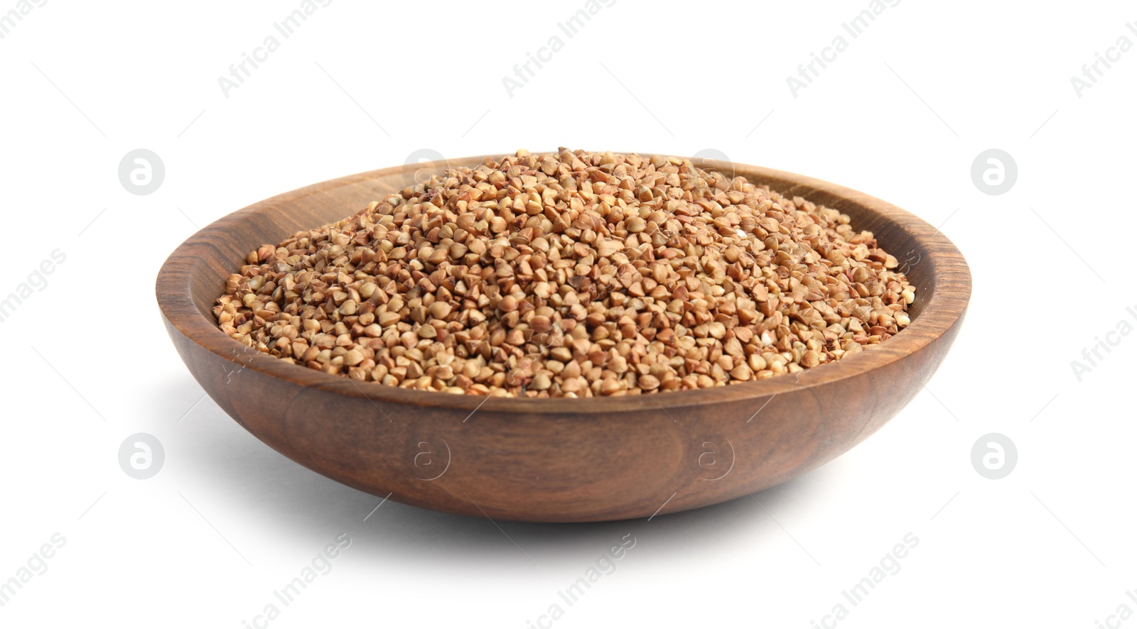 Photo of Bowl with uncooked buckwheat on white background