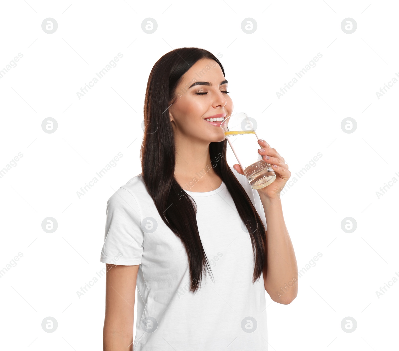 Photo of Beautiful young woman drinking tasty lemon water on white background