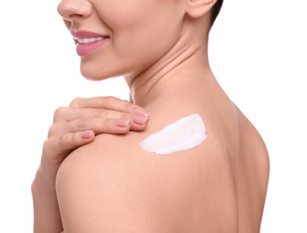 Photo of Woman with smear of body cream on her shoulder against white background, closeup