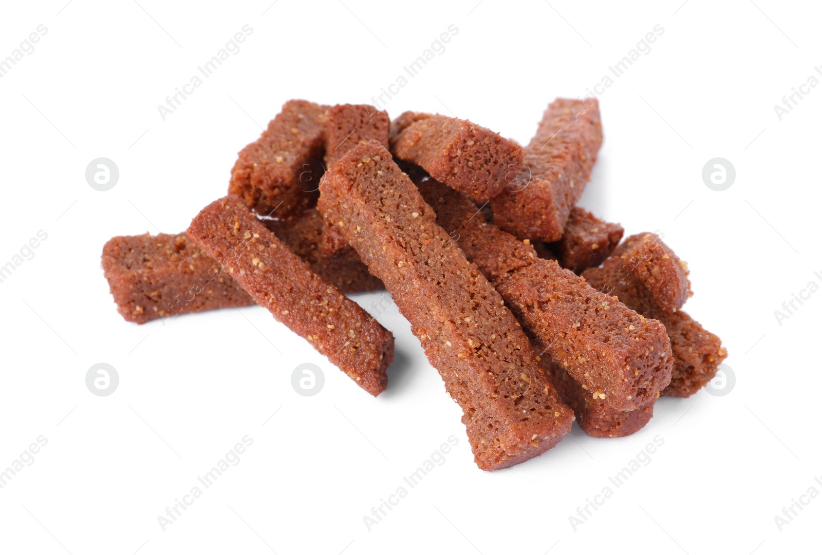 Photo of Pile of delicious crispy rusks on white background