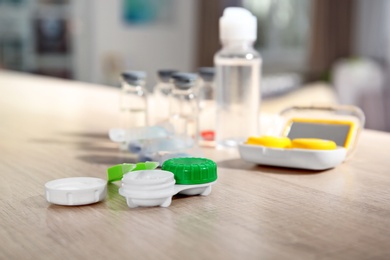 Photo of Contact lens accessories on wooden table