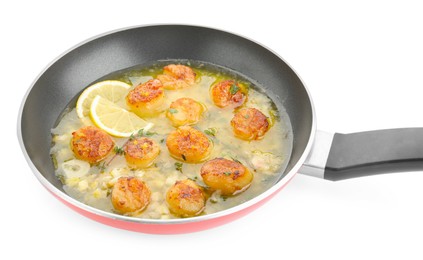 Delicious scallops with sauce in frying pan isolated on white