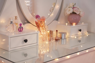 Photo of Elegant dressing table with lights in stylish room interior