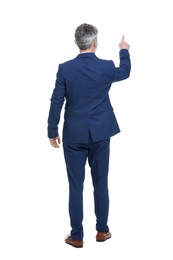 Photo of Mature businessman in stylish clothes posing on white background, back view