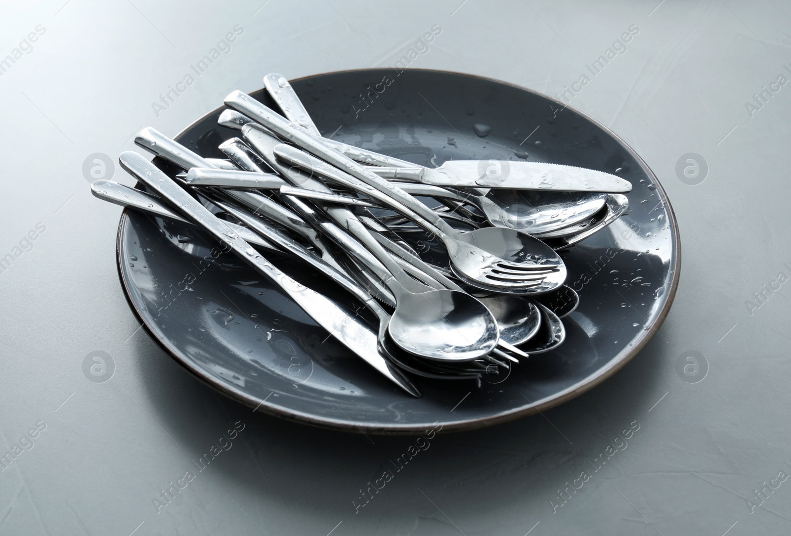 Photo of Different clean kitchenware on light grey table