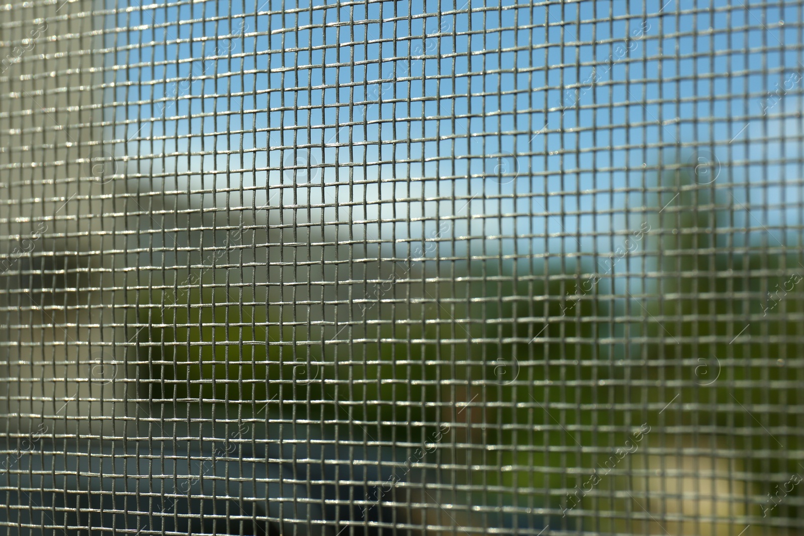 Photo of Closeup of mosquito window screen, view from inside