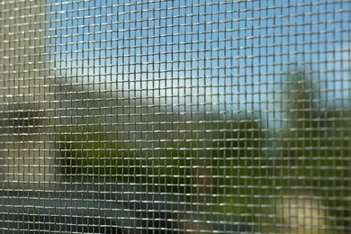 Closeup of mosquito window screen, view from inside