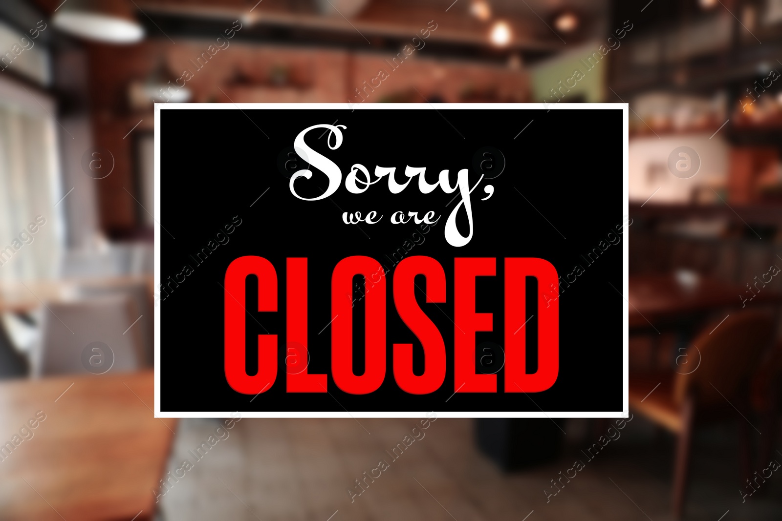 Image of Sorry we are closed sign against blurred background