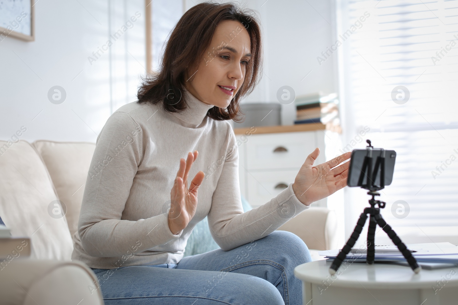 Photo of Teacher conducting online lesson at home during COVID-19 quarantine