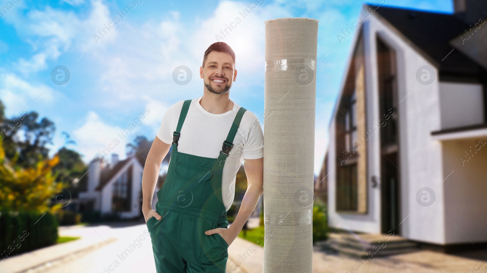 Image of Worker with rolled carpet outdoors on sunny day. Banner design