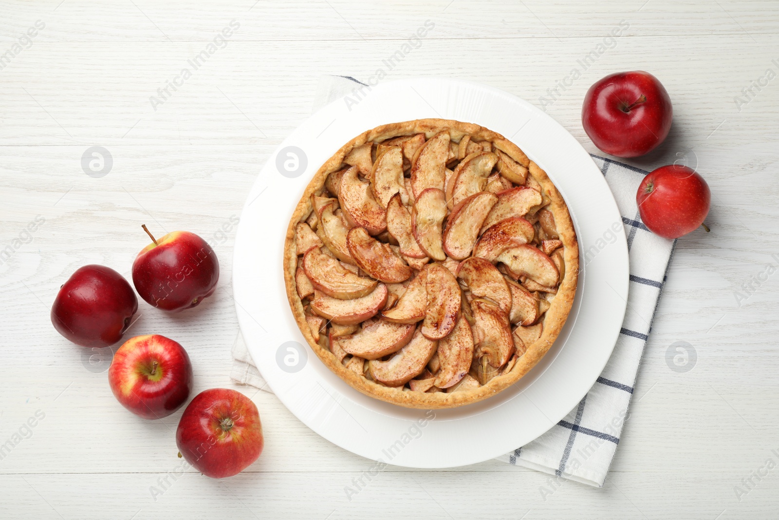 Photo of Delicious apple pie and fresh fruits on white wooden table, flat lay