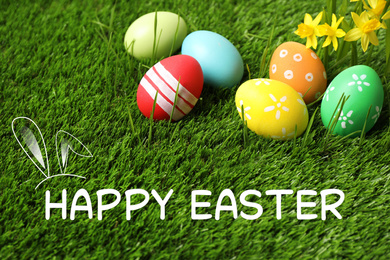 Image of Colorful eggs with narcissus flowers and text Happy Easter on green grass