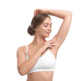 Photo of Young woman with smooth clean armpit on white background. Using deodorant