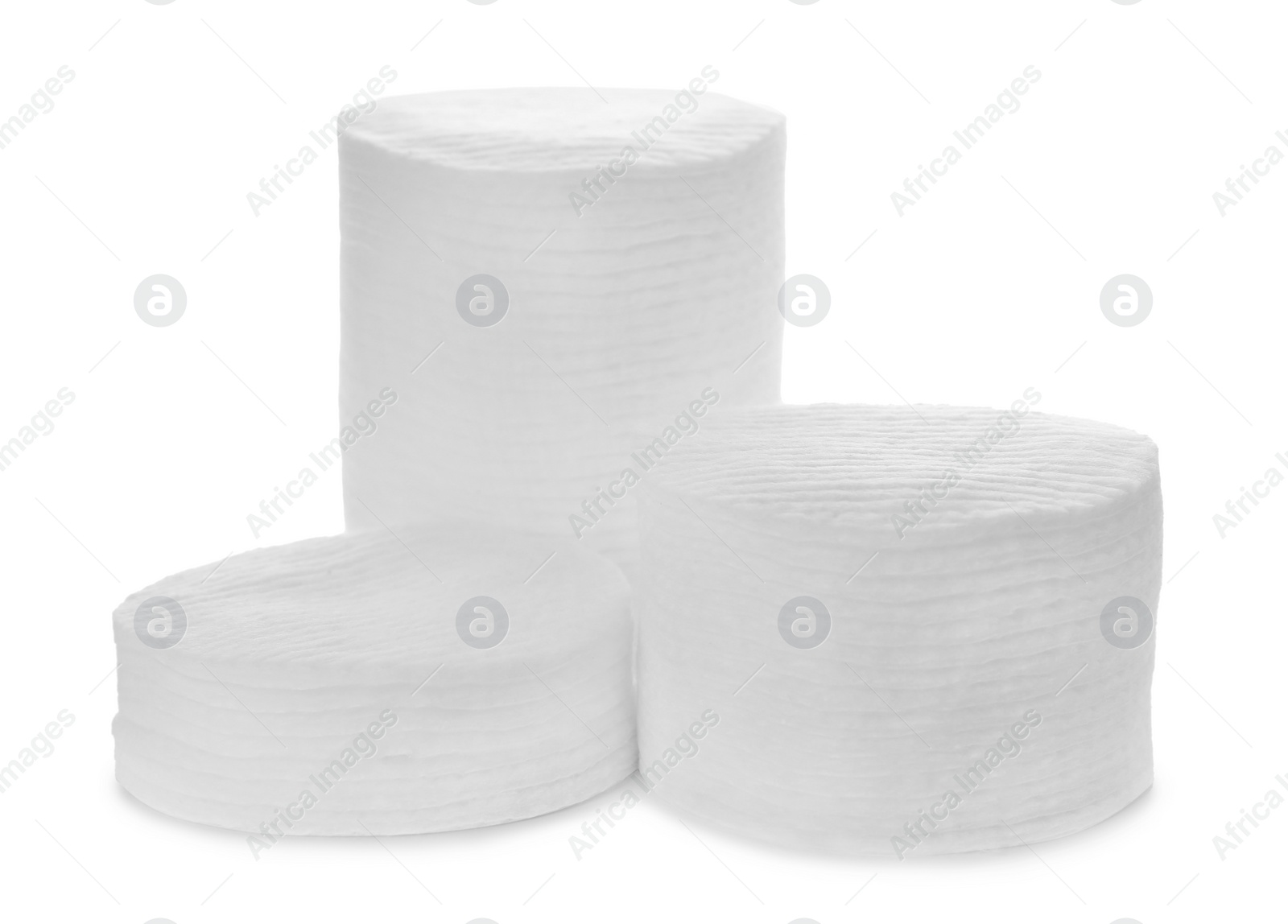 Photo of Stacks of cotton pads on white background