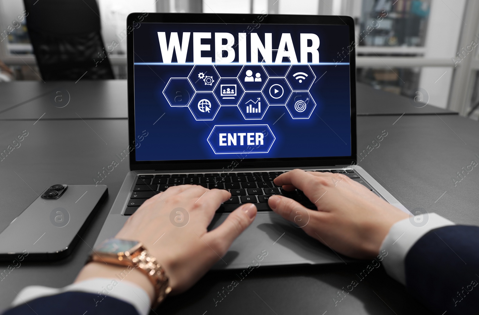 Image of Online webinar, web page on computer screen. Woman using laptop at black table, closeup