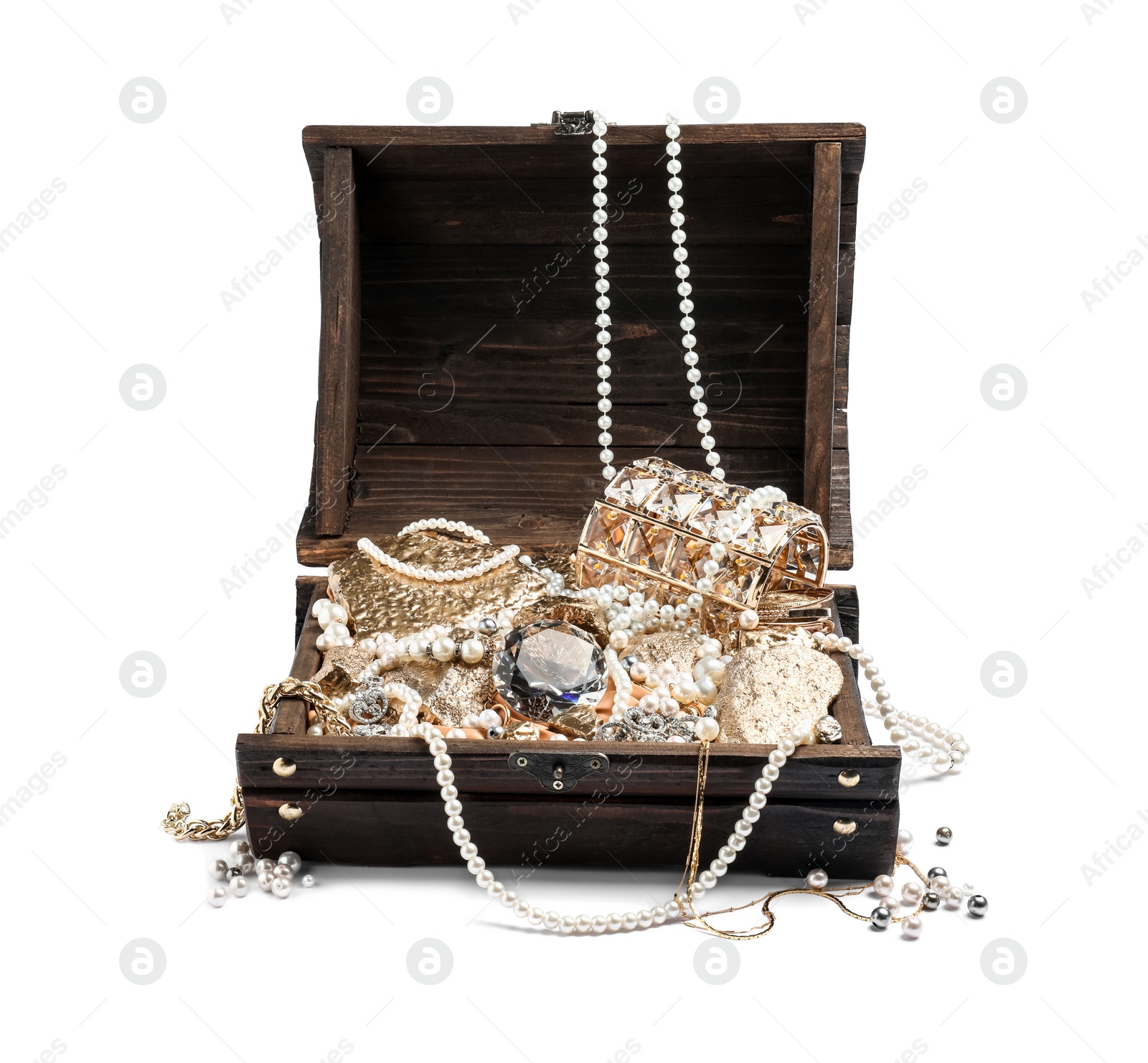 Photo of Wooden chest with treasures isolated on white