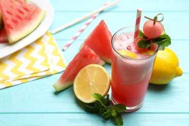 Delicious fresh watermelon drink on light blue wooden table