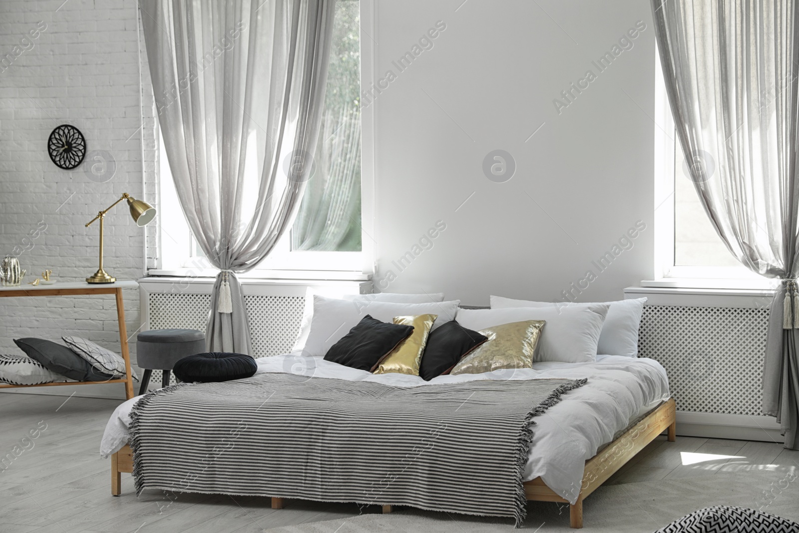 Photo of Stylish modern room interior with comfortable double bed