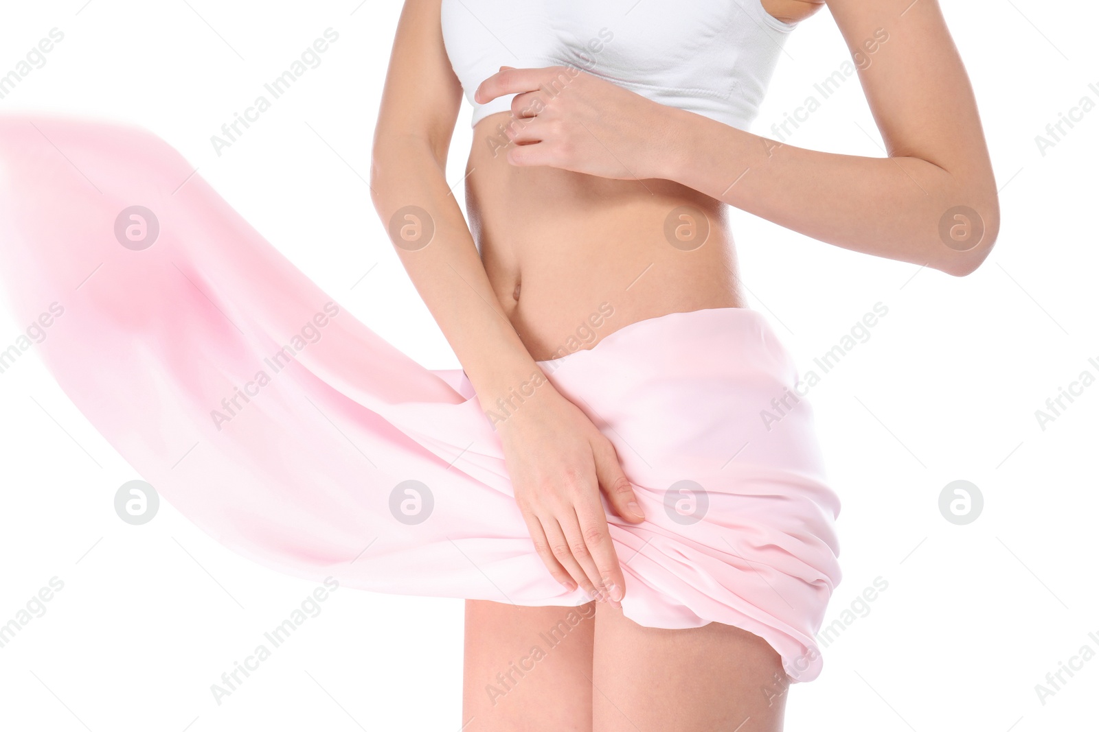 Photo of Young woman with perfect smooth skin and soft fabric on white background, closeup of belly. Beauty and body care