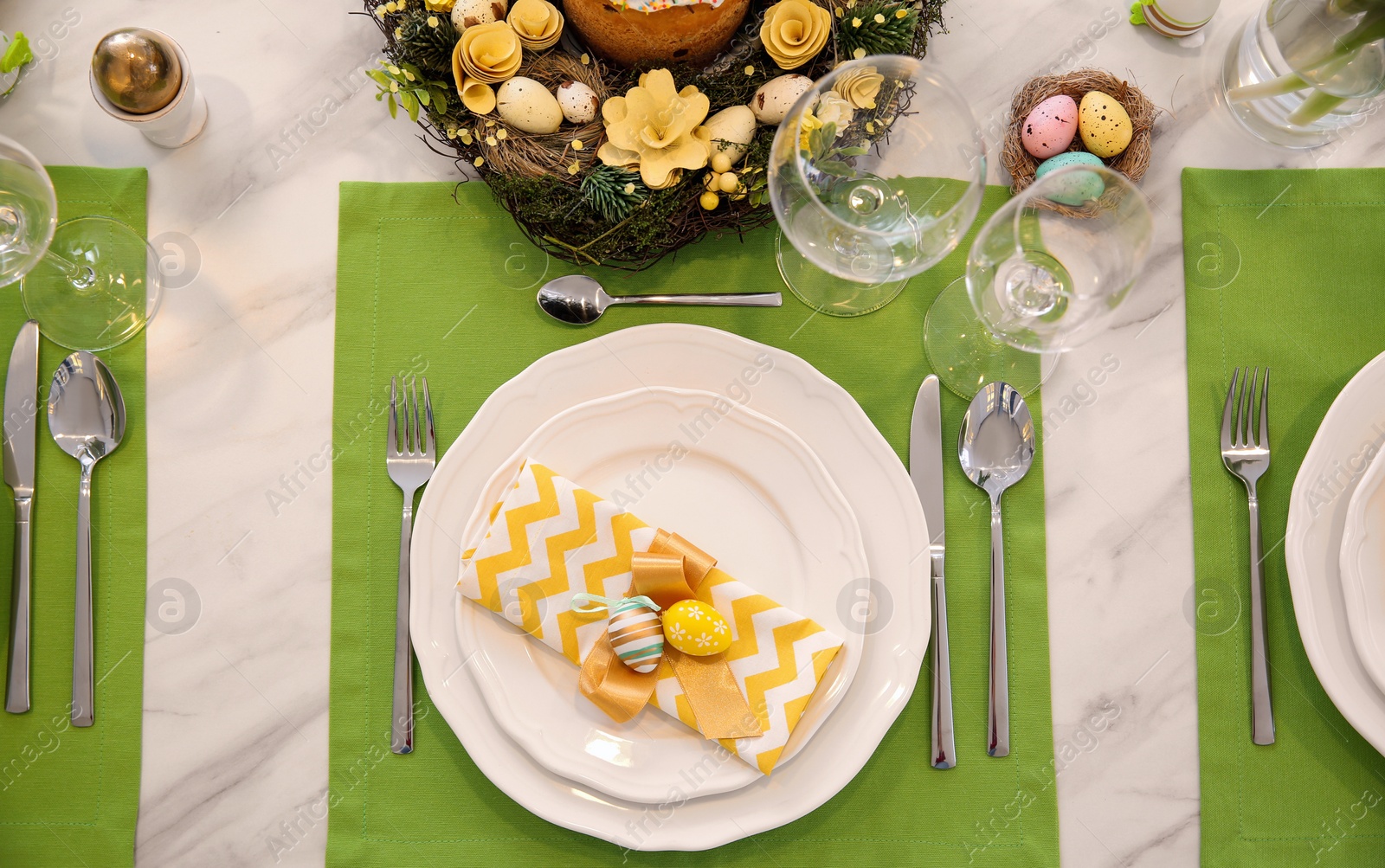 Photo of Festive Easter table setting with eggs, flat lay