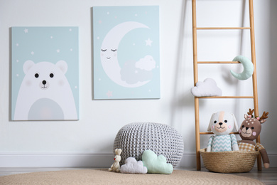 Photo of Baby room interior with toys and cute posters on wall